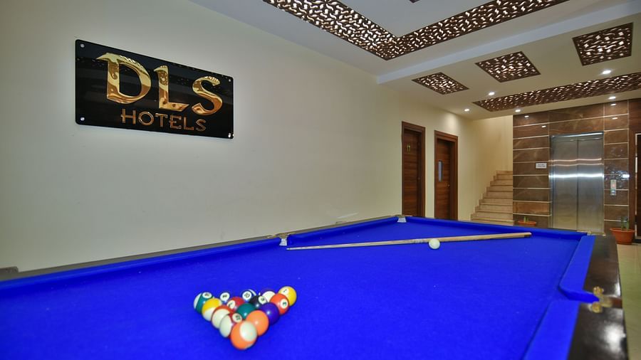 A pool table with billiard balls placed on the table at DLS Highland Resort and Spa, Mussoorie.
